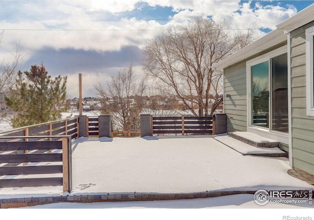 view of snow covered patio