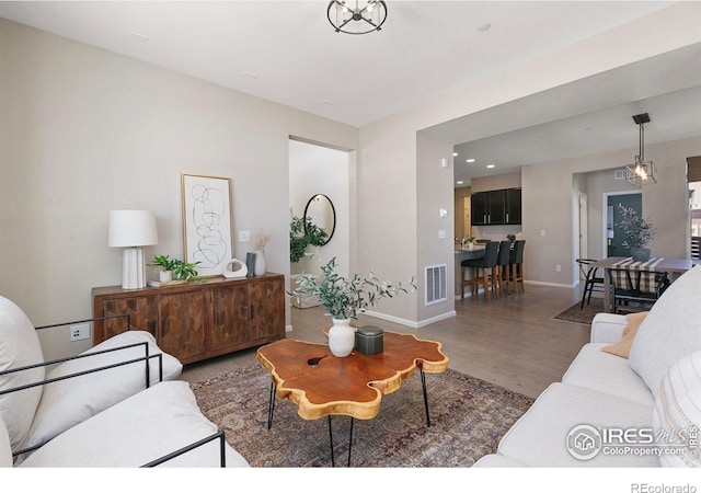 living room featuring dark wood-type flooring