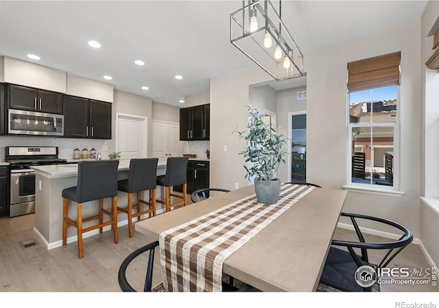 dining room featuring light hardwood / wood-style flooring