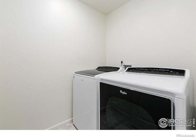 clothes washing area featuring washing machine and dryer