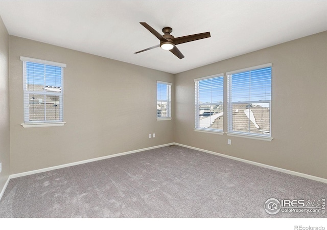 carpeted empty room with ceiling fan