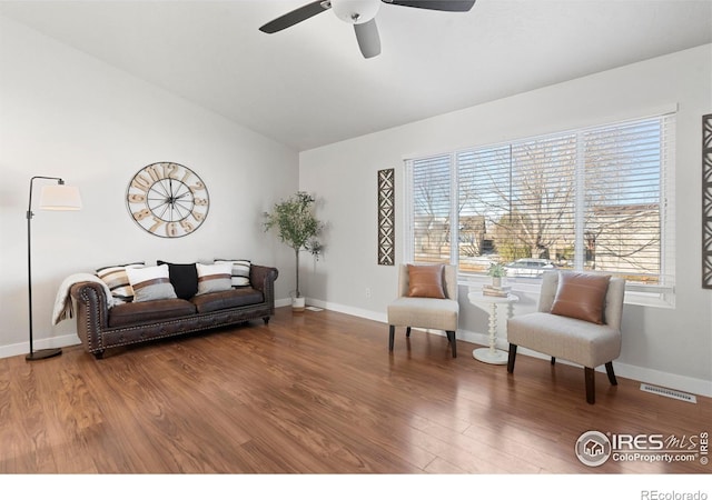 living room with hardwood / wood-style flooring and ceiling fan