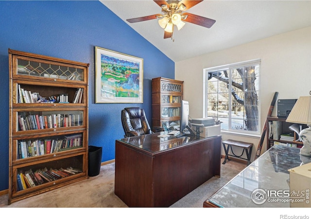 home office featuring baseboards, a ceiling fan, a textured wall, lofted ceiling, and carpet flooring