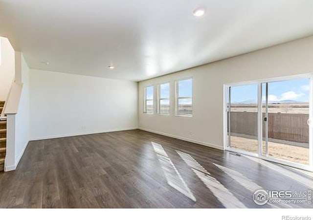 unfurnished room featuring dark hardwood / wood-style floors