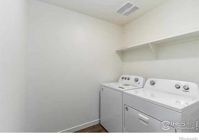 laundry room featuring washing machine and dryer