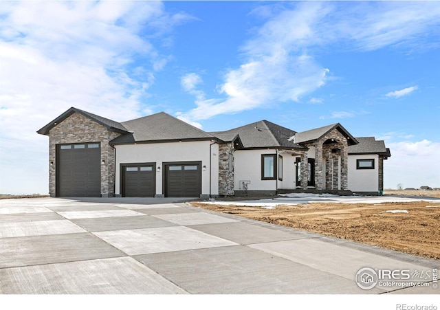 french country inspired facade featuring a garage