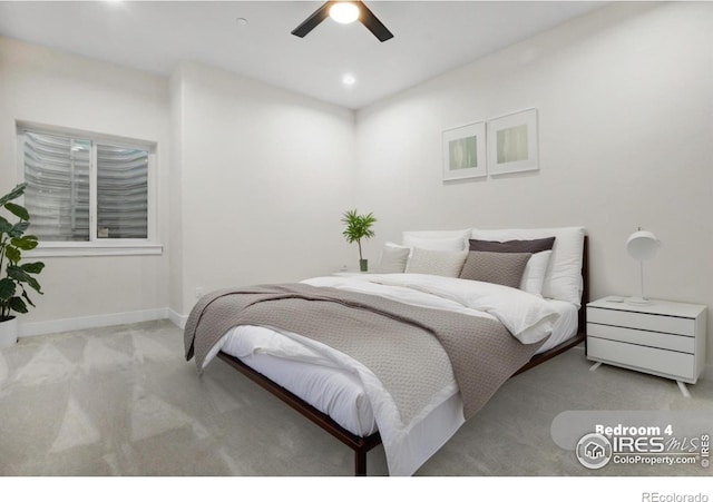 bedroom with light carpet and ceiling fan