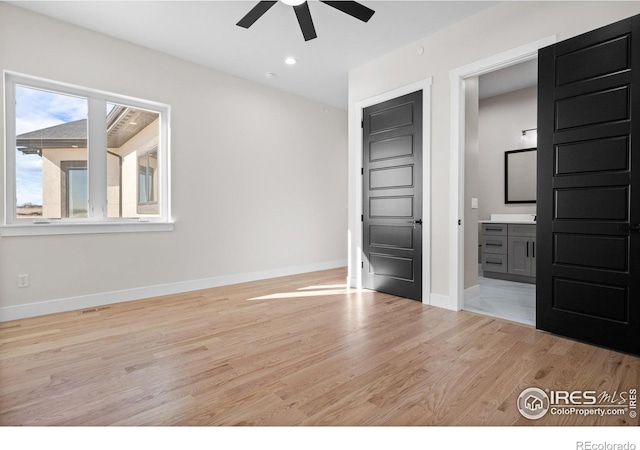 unfurnished bedroom featuring ceiling fan and light hardwood / wood-style floors