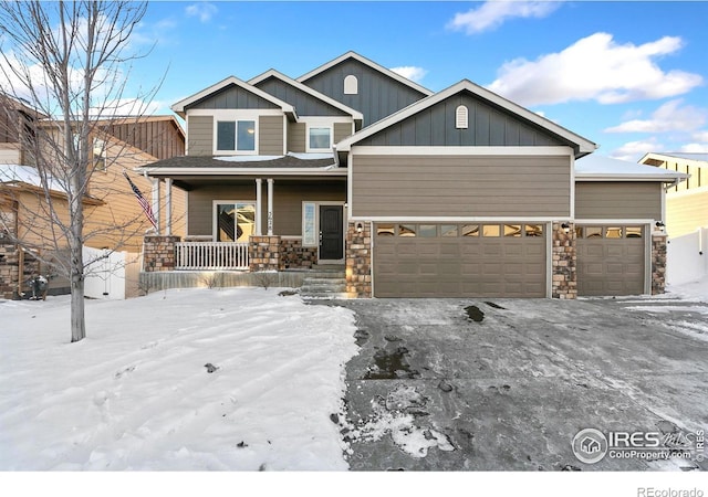 craftsman-style house featuring a porch and a garage