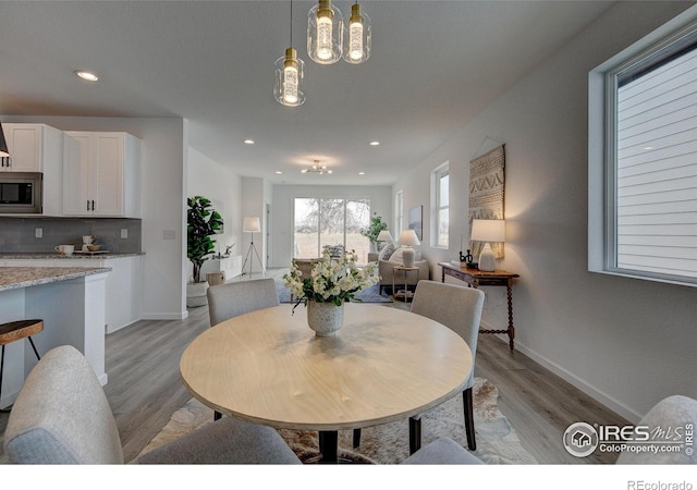 dining room with light hardwood / wood-style floors