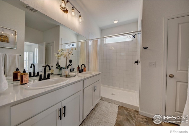 bathroom featuring vanity and walk in shower