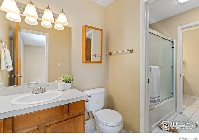 full bathroom with toilet, tile patterned floors, shower / bath combination with glass door, and vanity