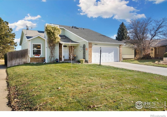 ranch-style house featuring a garage and a front yard