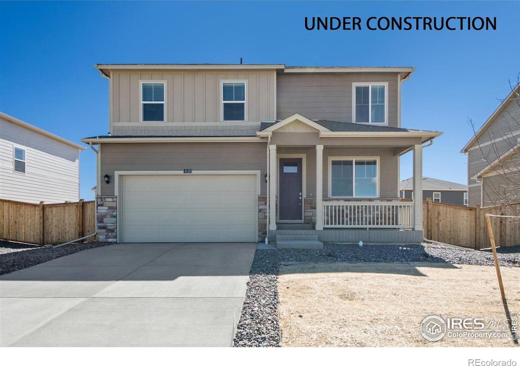 view of front of property with a garage and a porch