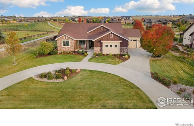 view of front of home featuring a garage and a front yard