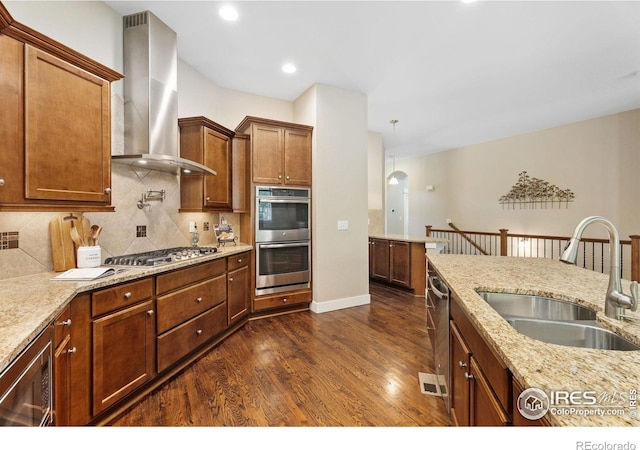 kitchen with sink, beverage cooler, dark hardwood / wood-style flooring, stainless steel appliances, and wall chimney range hood