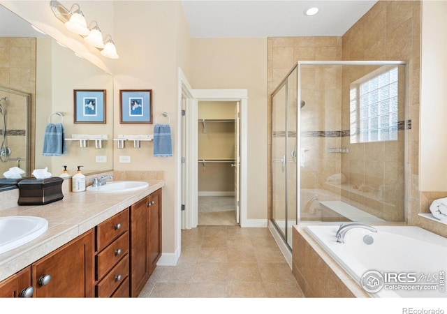 bathroom with vanity, separate shower and tub, and tile patterned flooring