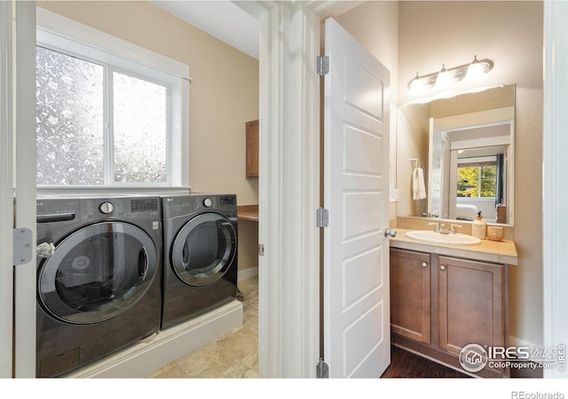 laundry room with sink and washer and clothes dryer