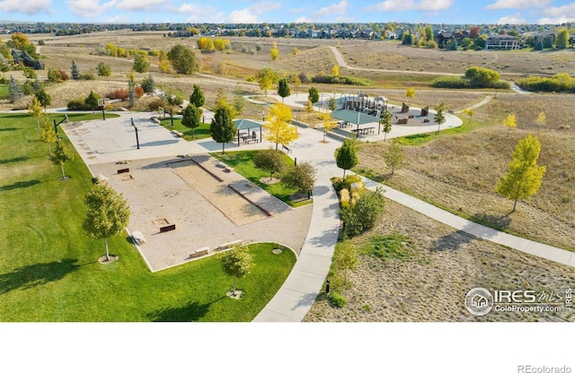 birds eye view of property with a rural view