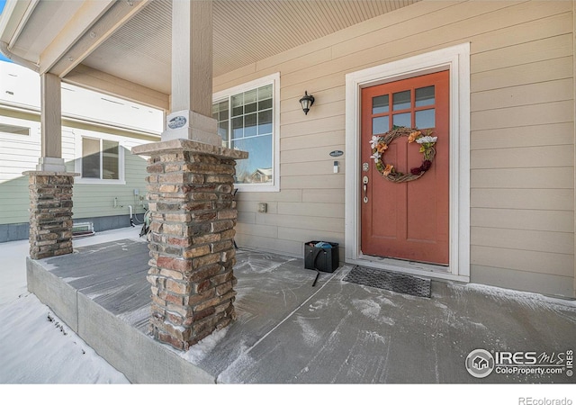 entrance to property with covered porch