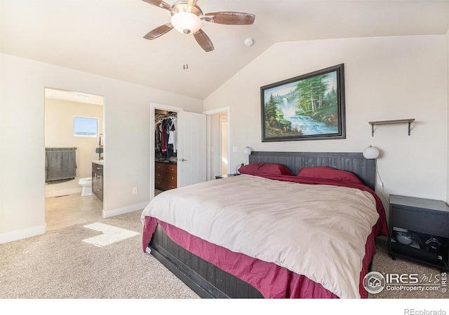 bedroom with a walk in closet, ceiling fan, light carpet, ensuite bath, and a closet