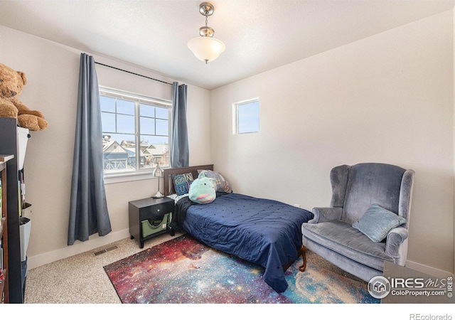 bedroom featuring carpet