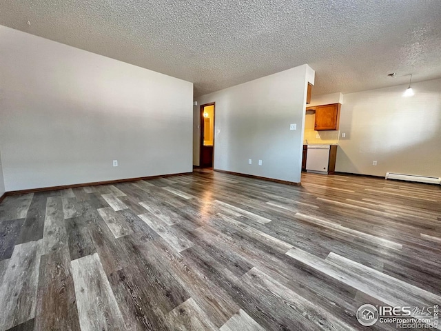 unfurnished living room featuring dark hardwood / wood-style floors, a textured ceiling, and baseboard heating