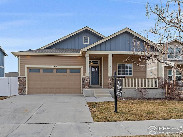 craftsman inspired home with a porch and a garage