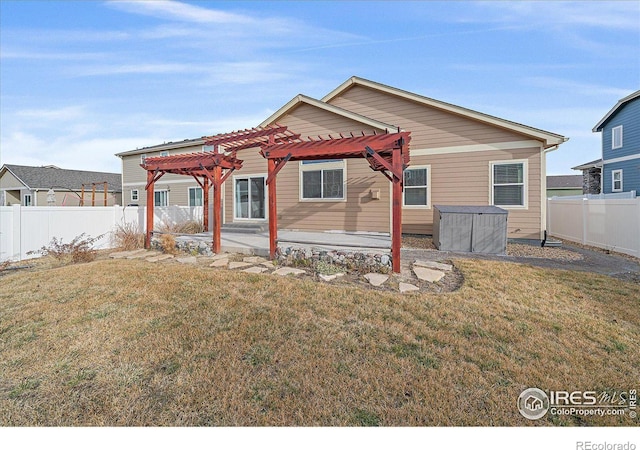 view of front facade with a patio area, a front lawn, and a pergola