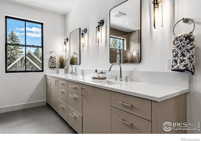 bathroom featuring tile patterned flooring and vanity