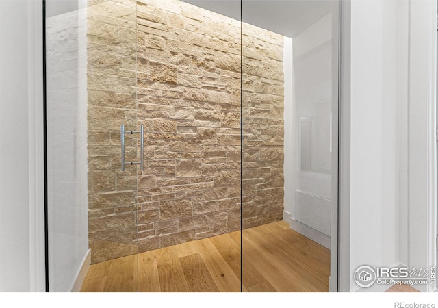 bathroom with wood-type flooring