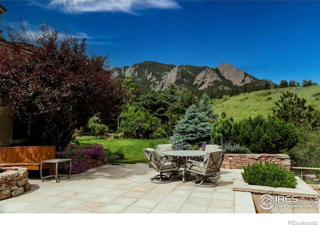 view of patio / terrace featuring a mountain view