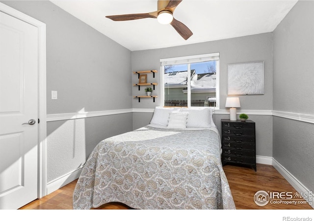 bedroom with light wood-type flooring and ceiling fan