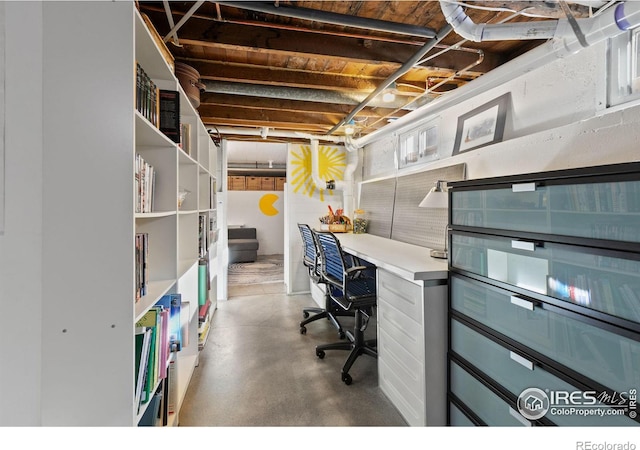 home office featuring concrete floors