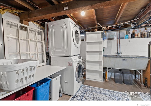 laundry area with stacked washer / dryer