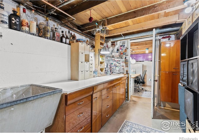 kitchen with beamed ceiling and wooden ceiling