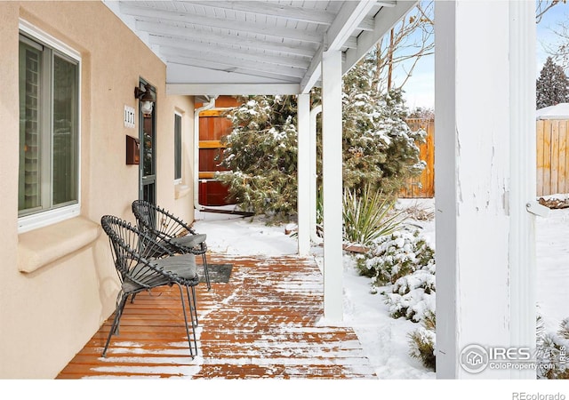 view of snow covered deck