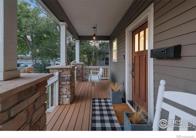 wooden terrace with covered porch