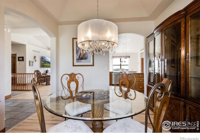 dining space with a notable chandelier