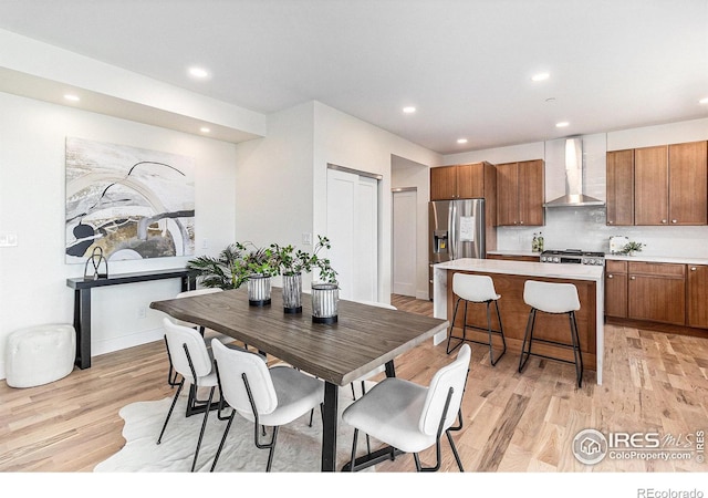 dining room with light hardwood / wood-style flooring