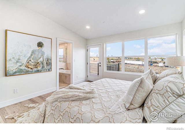 bedroom with lofted ceiling, access to outside, connected bathroom, and light hardwood / wood-style floors