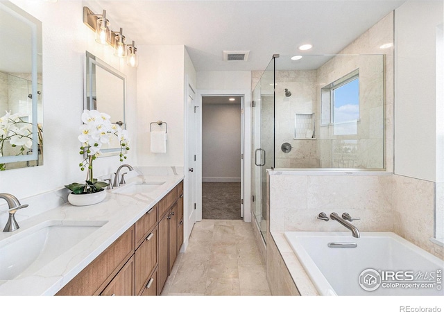 bathroom with shower with separate bathtub and vanity