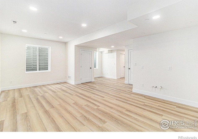 unfurnished room with light hardwood / wood-style floors