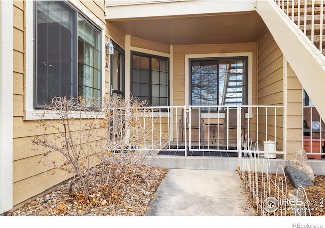 entrance to property featuring a porch