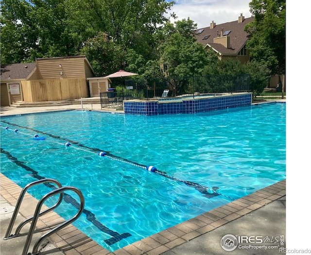 view of pool featuring pool water feature