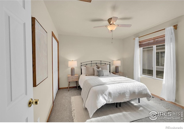 bedroom featuring ceiling fan and light carpet