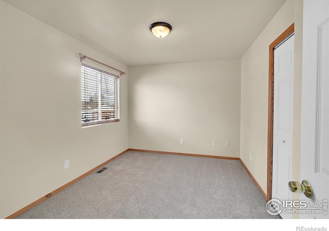 view of carpeted spare room