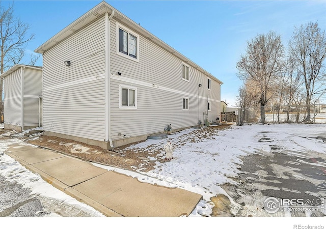 view of snow covered property