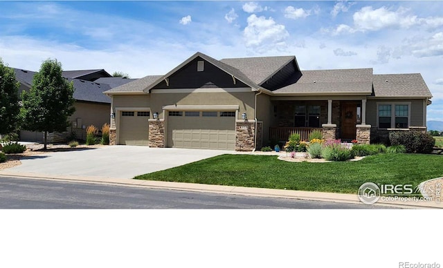 craftsman-style home with a porch, a garage, and a front yard