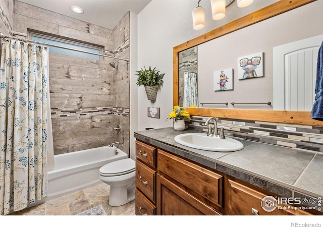 full bathroom with vanity, backsplash, toilet, and shower / bath combo